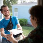 how to qualify for meals on wheels of Tampa -image of person receiving mean from a volunteer