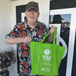 Meals on Wheels volunteer delivering a storm ready pack